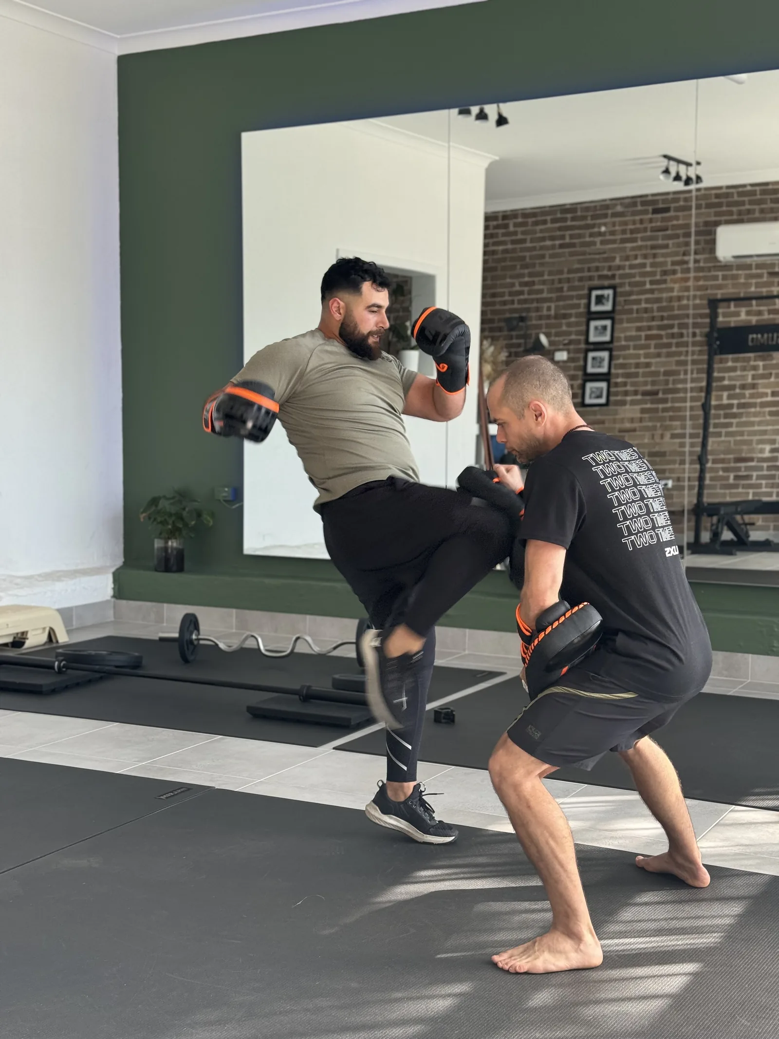 Kickboxing pad work during a session at the Adiyoga studio in Earlwood
