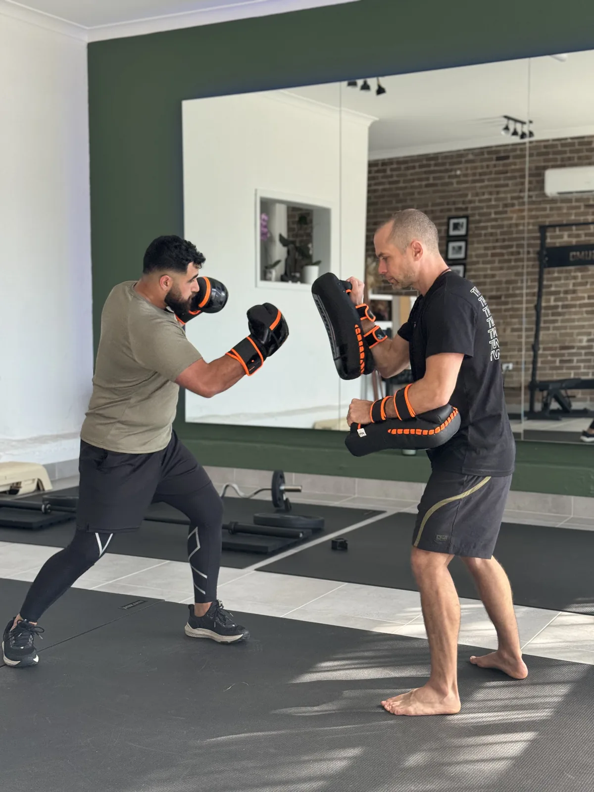 Boxing pad work and technique training at Adiyoga in Earlwood
